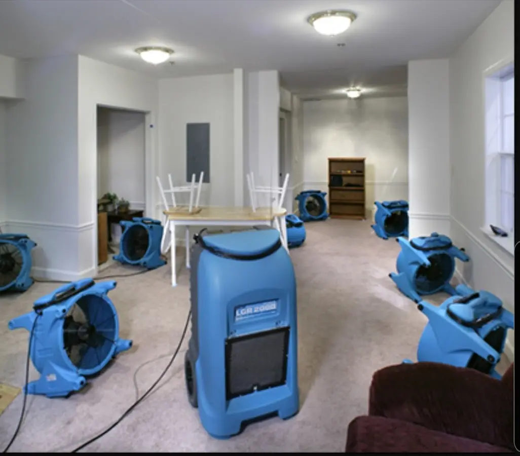 Air movers and dehumidifier setup for Water Damage Restoration in Homer
